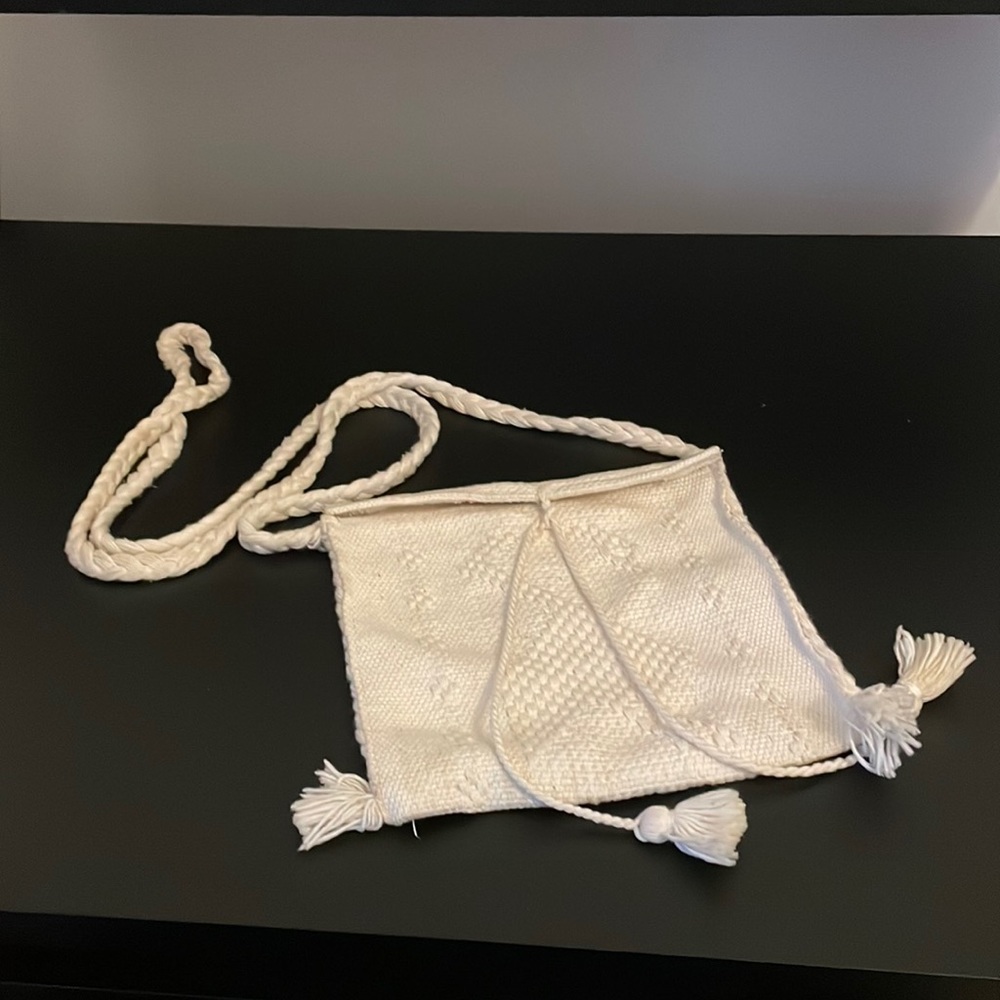 Small cream colored purse; breaded strap; handmade